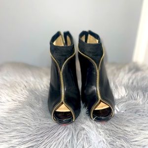 Christian Louboutin peep toe bootie heels with zipper.